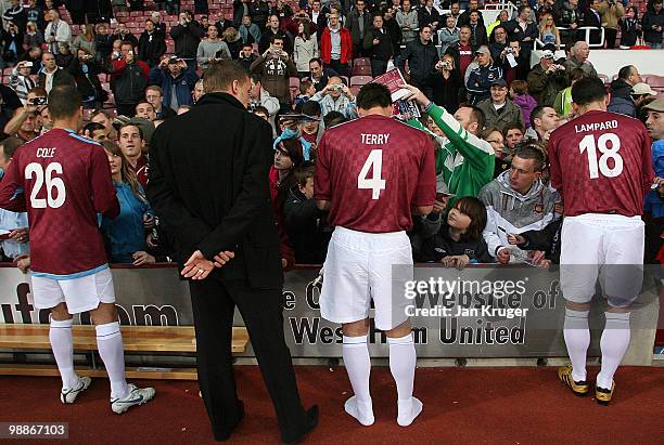 Joe Cole, John Terry and Frank Lampard of the Academy All-Stars team signs autographs during the Tony Carr Testimonial match between the Academy...