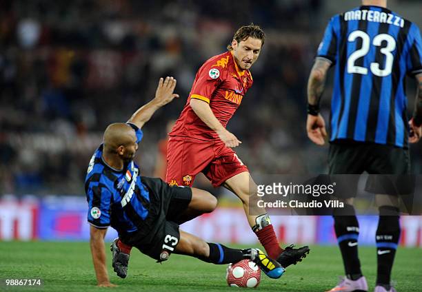 Francesco Totti of AS Roma competes for the ball with Maicon of FC Internazionale Milano during the Tim Cup between FC Internazionale Milano and AS...