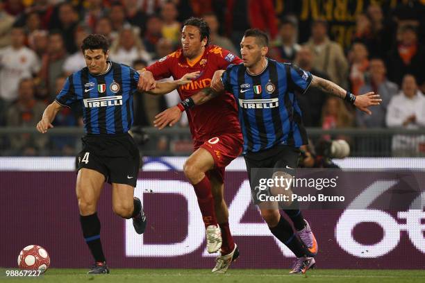 Javier Zanetti and Marco Materazzi of FC Internazionale Milano with Luca Toni of AS Roma compete for the ball during the Tim Cup between FC...