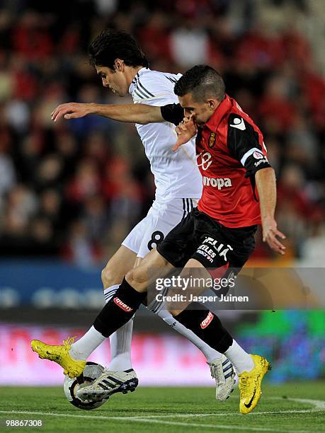 Kaka of Real Madrid duels for the ball with Julio Alvarez of Mallorca during the La Liga match between Mallorca and Real Madrid at the ONO Estadio on...