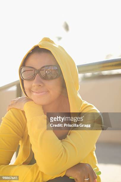 mixed race woman in sunglasses and hoody - coronado island 個照片及圖片檔