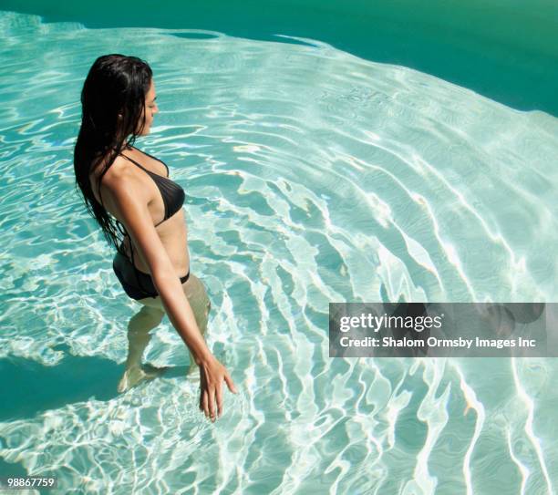 hispanic woman in swimming pool - san rafael california stock pictures, royalty-free photos & images