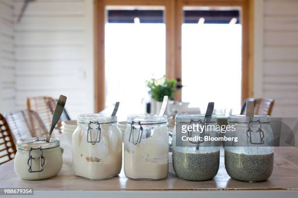 Yogurt made by chef Camilla Kaarla-Haverinen sits in jars in the dining area of a guest cabin on SuperShe island near Raasepori, Finland, on...
