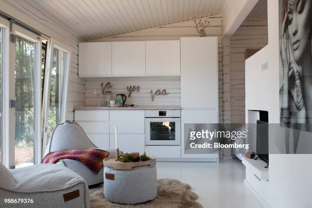 Beanbag chairs sit in the seating and kitchen area of a guest cabin on SuperShe island near Raasepori, Finland, on Wednesday, June 27, 2018. The...