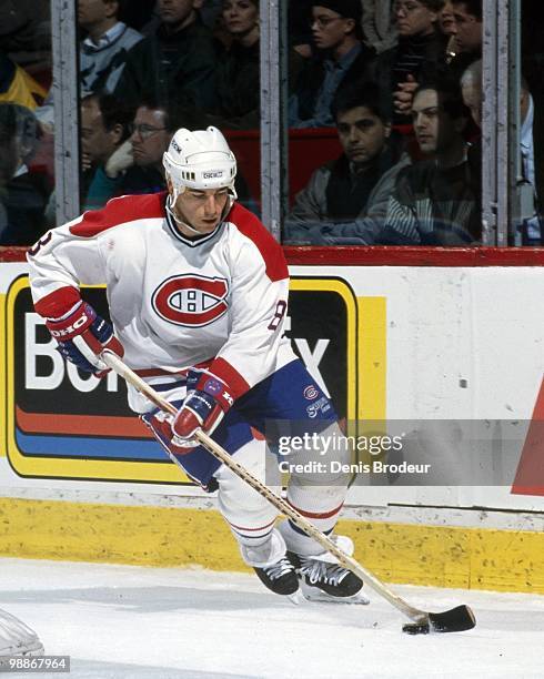 Mark Recchi of the Montreal Canadiens skates with the puck during the 1990's at the Montreal Forum in Montreal, Quebec, Canada. Recchi played for the...