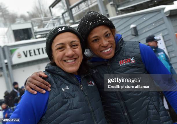 American bobsleigh athletes Lauren Gibbs and Elana Meyers Taylor cheer over their second place after the women's two person bob event at the BMW IBSF...