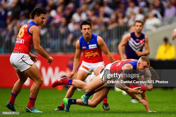 Mitch Robinson of the Lions dives on the ball during the 2018 AFL round15 match between the Fremantle Dockers and the Brisbane Lions at Optus Stadium...