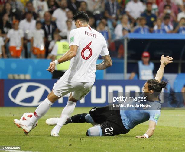 Jose Fonte of Portugal is challenged by Martin Caceres of Uruguay during the first half of Uruguay's 2-1 win in a World Cup round-of-16 match in...