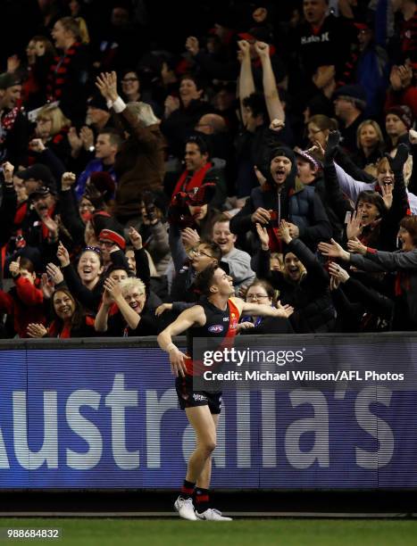 Orazio Fantasia of the Bombers celebrates a goal with the crowd during the 2018 AFL round15 match between the Essendon Bombers and the North...