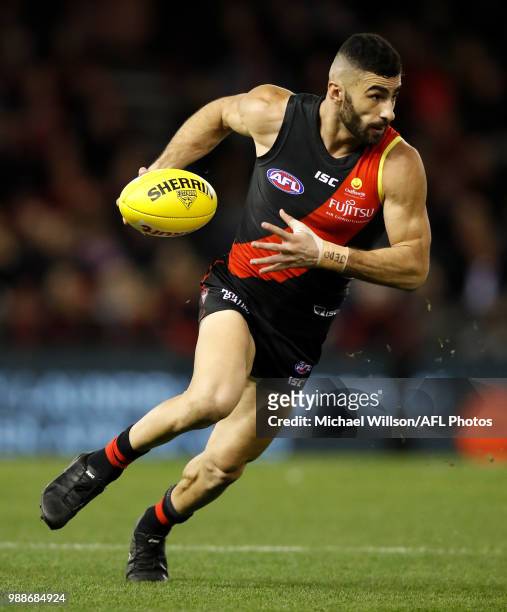 Adam Saad of the Bombers in action during the 2018 AFL round15 match between the Essendon Bombers and the North Melbourne Kangaroos at Etihad Stadium...