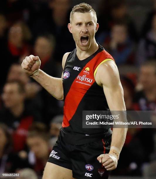 Shaun McKernan of the Bombers celebrates a goal during the 2018 AFL round15 match between the Essendon Bombers and the North Melbourne Kangaroos at...