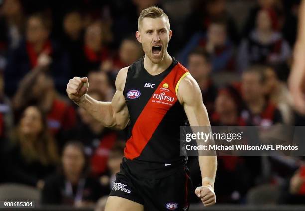 Shaun McKernan of the Bombers celebrates a goal during the 2018 AFL round15 match between the Essendon Bombers and the North Melbourne Kangaroos at...