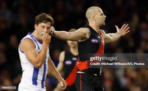 Jake Stringer of the Bombers celebrates a goal during the 2018 AFL round15 match between the Essendon Bombers and the North Melbourne Kangaroos at...