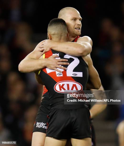 Jake Stringer of the Bombers and Adam Saad of the Bombers celebrate during the 2018 AFL round15 match between the Essendon Bombers and the North...