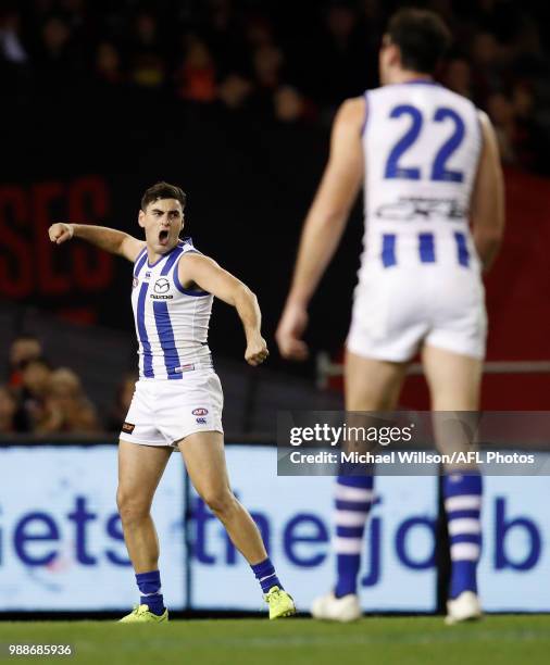 Paul Ahern of the Kangaroos celebrates a goal during the 2018 AFL round15 match between the Essendon Bombers and the North Melbourne Kangaroos at...