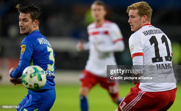 Wolfburg's Paul Verhaegh and Hamburg's Andre Hahn vie for the ball during the German Bundesliga football match between Hamburg SV and VfL Wolfsburg...