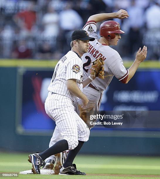 Kelly Johnson of the Arizona Diamondbacks slides safely into second base as second baseman Jeff Keppinger of the Houston Astros is late on the tag at...