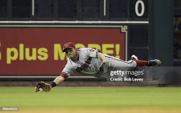 Left fielder Gerardo Parra of the Arizona Diamondbacks makes a diving catch on a ball hit by Geoff Blum of the Houston Astros at Minute Maid Park on...