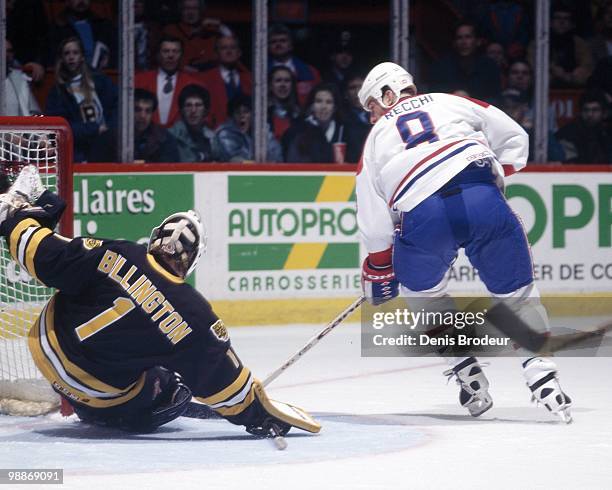 Mark Recchi of the Montreal Canadiens skates against Craig Billington of the Boston Bruins during the 1990's at the Montreal Forum in Montreal,...