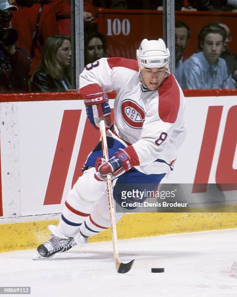 Mark Recchi of the Montreal Canadiens skates with the puck during the 1990's at the Montreal Forum in Montreal, Quebec, Canada. Recchi played for the...