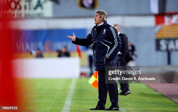 Real Madrid coach Manuel Pellegrini gives instructions during the La Liga match between Mallorca and Real Madrid at Ono Estadi on May 5, 2010 in...