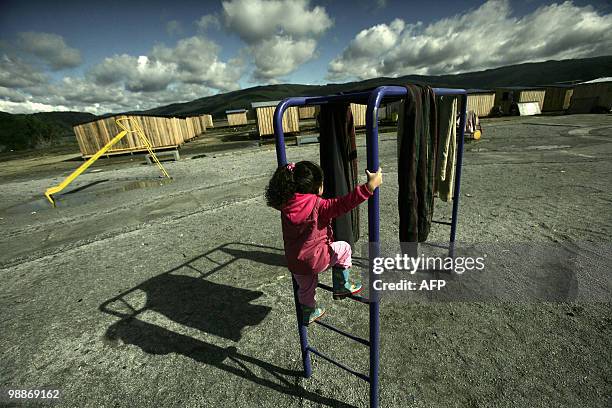 Child plays at a square near to provisional dwellings for people displaced by February 27th's earthquake and the ensueing tsunami, in Concepcion some...