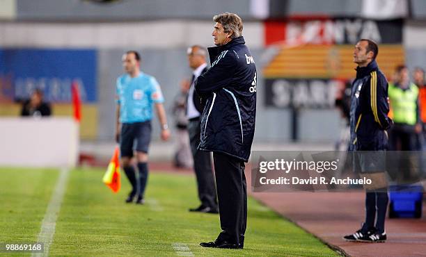 Real Madrid coach Manuel Pellegrini looks on during the La Liga match between Mallorca and Real Madrid at Ono Estadi on May 5, 2010 in Mallorca,...