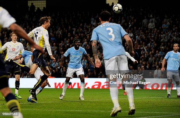 Peter Crouch of Tottenham Hotspur scores the opening goal during the Barclays Premier League match between Manchester City and Tottenham Hotspur at...