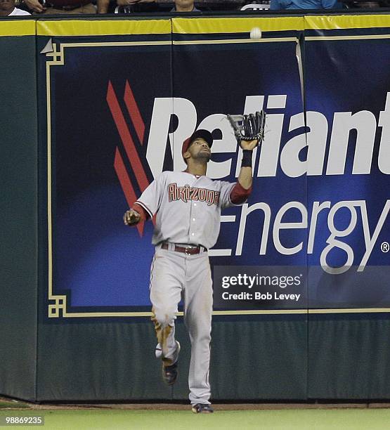 Center fielder Chris Young of the Arizona Diamondbacks makes a catch deep in center field against the Houston Astros at Minute Maid Park on May 4,...