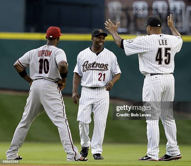 Michael Bourn and Carlos Lee of the Houston Astros and Justin Upton of the Arizona Diamondbacks laugh it up in pregame warmsup at Minute Maid Park on...