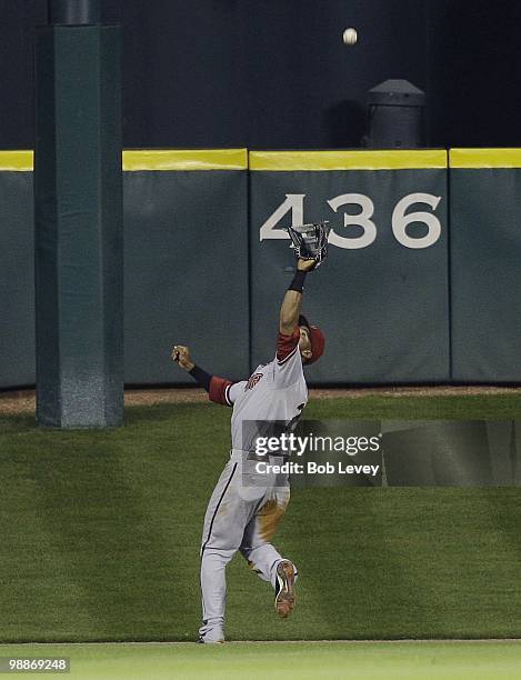 Center fielder Chris Young of the Arizona Diamondbacks makes a catch deep in center field against the Houston Astros at Minute Maid Park on May 4,...