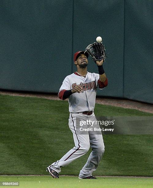 Center fielder Chris Young of the Arizona Diamondbacks makes a catch deep in center field against the Houston Astros at Minute Maid Park on May 4,...