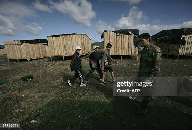 Provisional encampment for refugees of February 27th's earthquake and the ensueing tsunami at Penco's port in Concepcion, some 500 km south of...