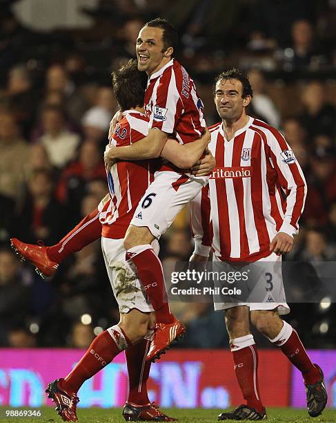 Matthew Etherington of Stoke City celebrates with Dean Whitehead and Danny Higginbotham after he scores their first goal during the Barclays Premier...