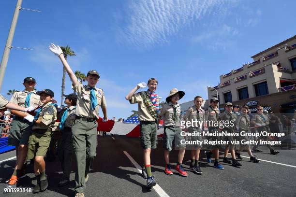 Boy Scouts carry Huntington Beach's Historic "Freedom Flag" as the start of the 113th annual 4th of July Parade on Tuesday, July 4, 2017. "n"n