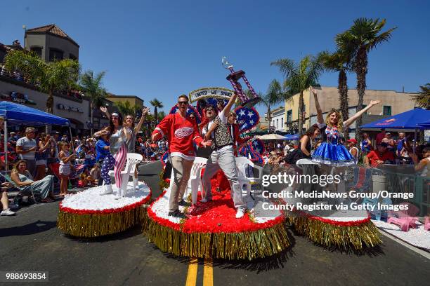 Performers on the Identifibo.com float re-enacting the parade scene from Ferris Bueller's Day during the 113th annual Huntington Beach 4th of July...