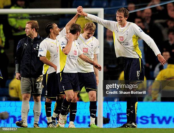 Peter Crouch of Tottenham Hotspur celebrates with his team mates at the end of the Barclays Premier League match between Manchester City and...