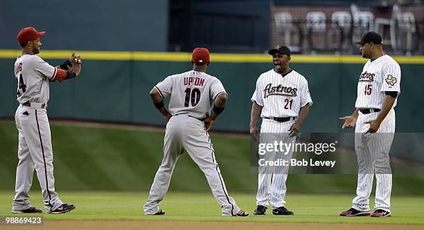 Michael Bourn and Carlos Lee of the Houston Astros and Justin Upton of the Arizona Diamondbacks laugh it up in pre -game warmsup at Minute Maid Park...