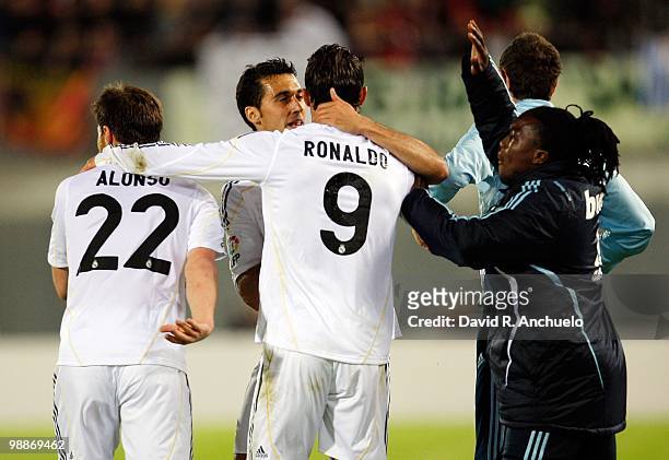 Cristiano Ronaldo of Real Madrid celebrates with Royston Drenthe , Alvaro Arbeloa and Xabi Alonso during the La Liga match between Mallorca and Real...