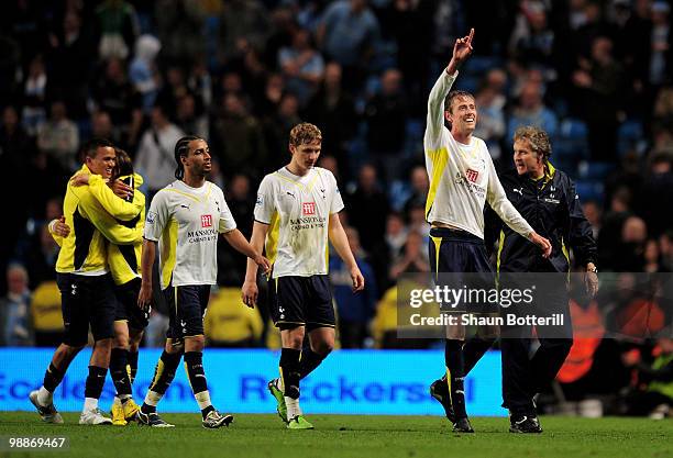 Peter Crouch of Tottenham Hotspur celebrates with his team mates at the end of the Barclays Premier League match between Manchester City and...