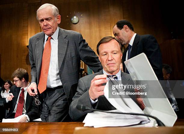 William Donaldson, former chairman, Securities and Exchange Commission , left, takes his seat next to Christopher Cox, also a former SEC chairman,...