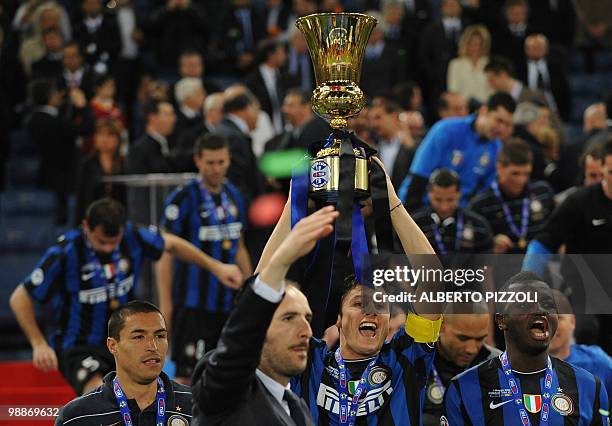 Inter Milan's Argentinian defender and captain Javier Aldemar Zanetti holds the trophy after his team defeated AS Roma in the Coppa Italia final on...