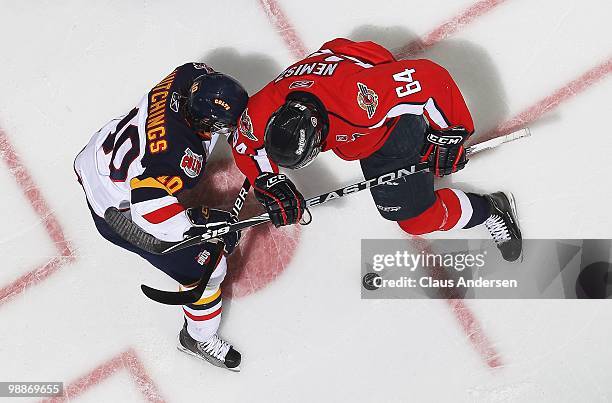 Greg Nemisz of the Windsor Spitfires battles for control of the puck with Alex Hutchings of the Barrie Colts in the 4th game of the OHL Championship...