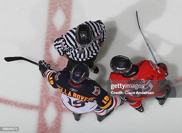 Linseman Kevin Hastings explains the call on an illegal goaltending stick to captains Stefan Della Rovere of the Barrie Colts and Harry Young of the...