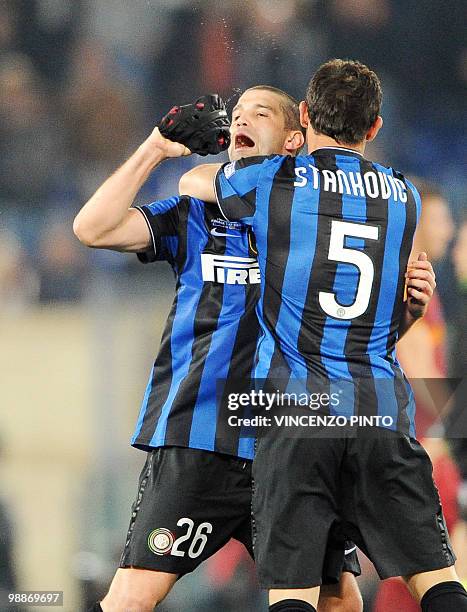 Inter Milan's Serbian midfielder Dejan Stankovic and Romanian defender Cristian Chivu celebrate after defeating AS Roma in the Coppa Italia final on...