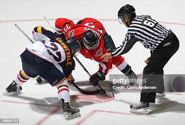 Scott Timmins of the Windsor Spitfires takes a faceoff against taylor Carnevale of the Barrie Colts in the 4th game of the OHL Championship Final on...