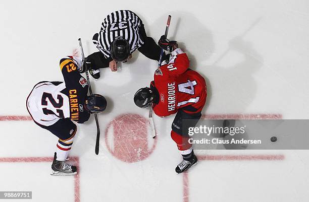 Adam Henrique of the Windsor Spitfires takes a faceoff against Taylor Carnevale of the Barrie Colts in the 4th game of the OHL Championship Final on...