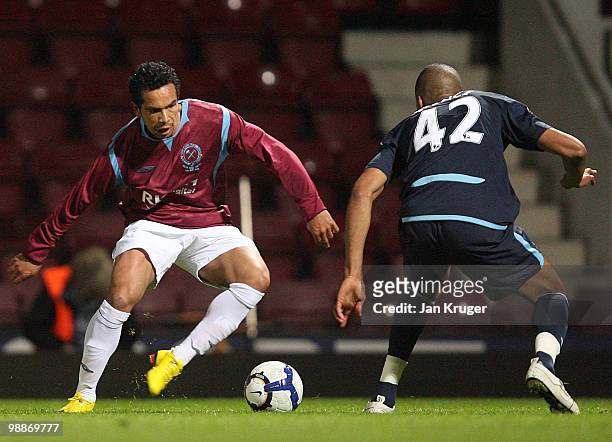 Kieran Richardson of the Academy All-Stars competes for the ball with Jordan Spence of West Ham United during the Tony Carr Testimonial match between...