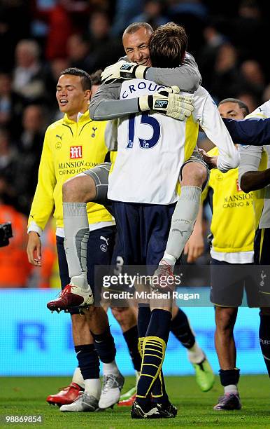 Peter Crouch of Tottenham Hotspur celebrates with his team mate Hueurelho Gomes at the end of the Barclays Premier League match between Manchester...