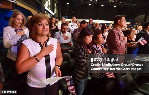 Mary Hanne, of Mission Viejo, stands for the National Anthem during a ceremony at City National Grove of Anaheim, on Thursday, June 22, 2017. "n"nThe...